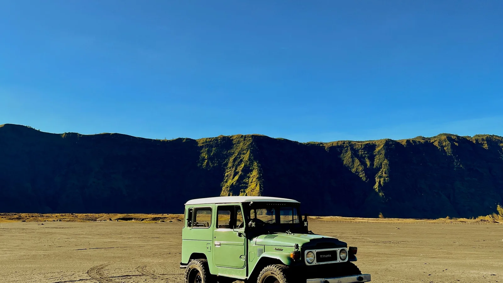The sea of sand beneath Mount Batok at Mount Bromo