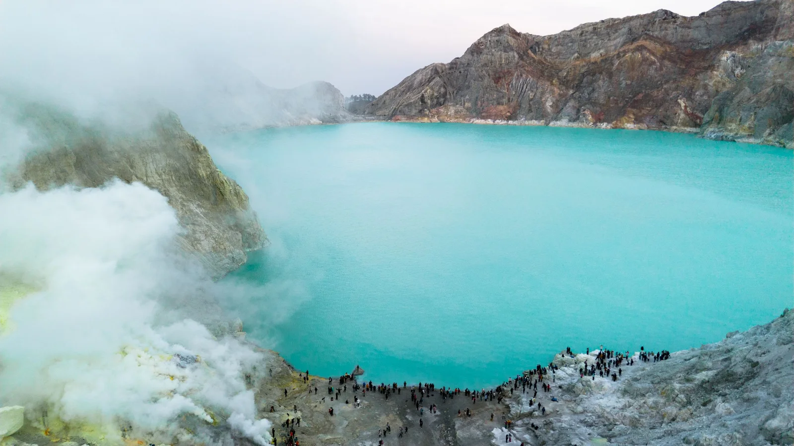 Steam rising from the turquoise crater lake at Kawah Ijen
